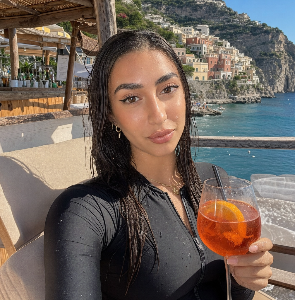 gpt-image-2 render: Relaxed Amalfi Coast Sunbather With Wet Hair And Drink