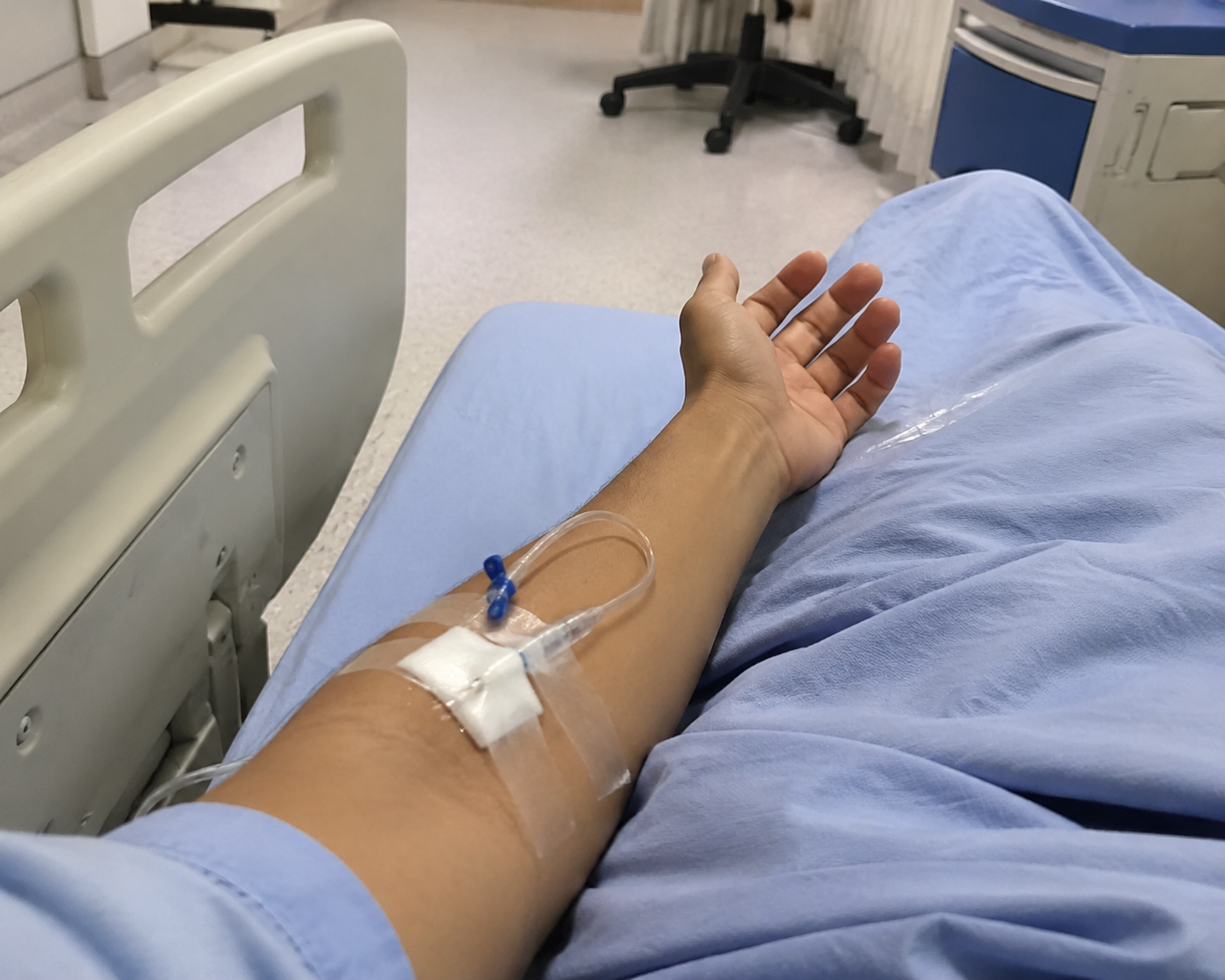 gpt-image-2 render: Hospital Patient With Arm Extended, Needle Insertion Scene