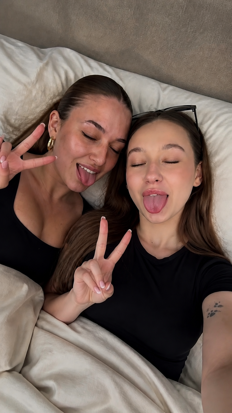 gpt-image-2 render: Playful Crouching Pair Making V Signs, Tongues Out