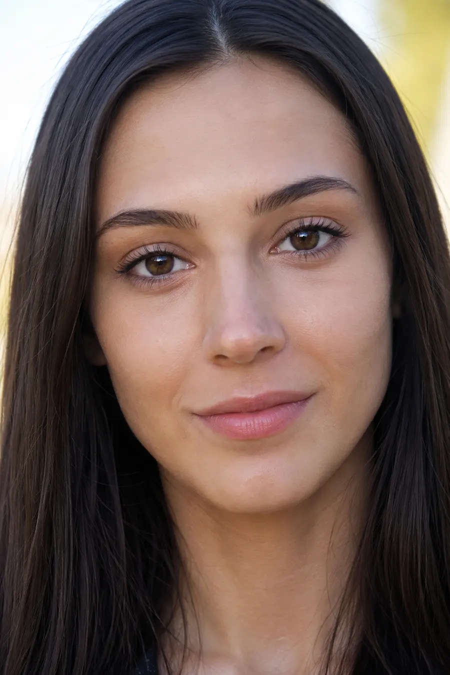 A slim, tall, sports figure, graceful, twenty years-old Polish woman with dark, long, straight hair that falls loosel...