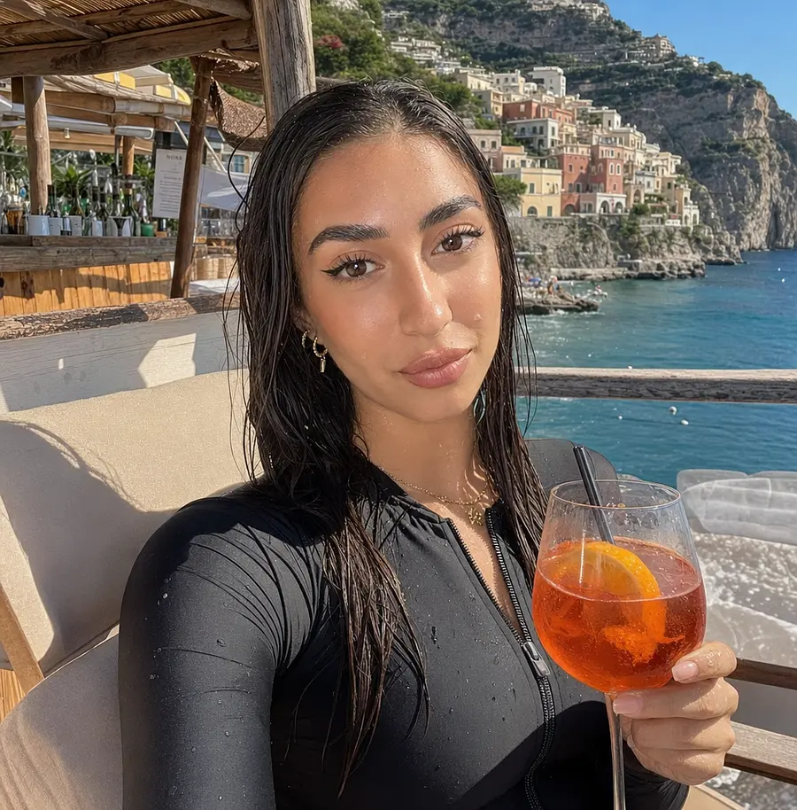 Relaxed Amalfi Coast Sunbather With Wet Hair And Drink