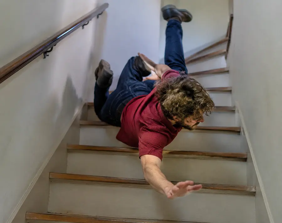Make a pi ture of a guy falling down stairs